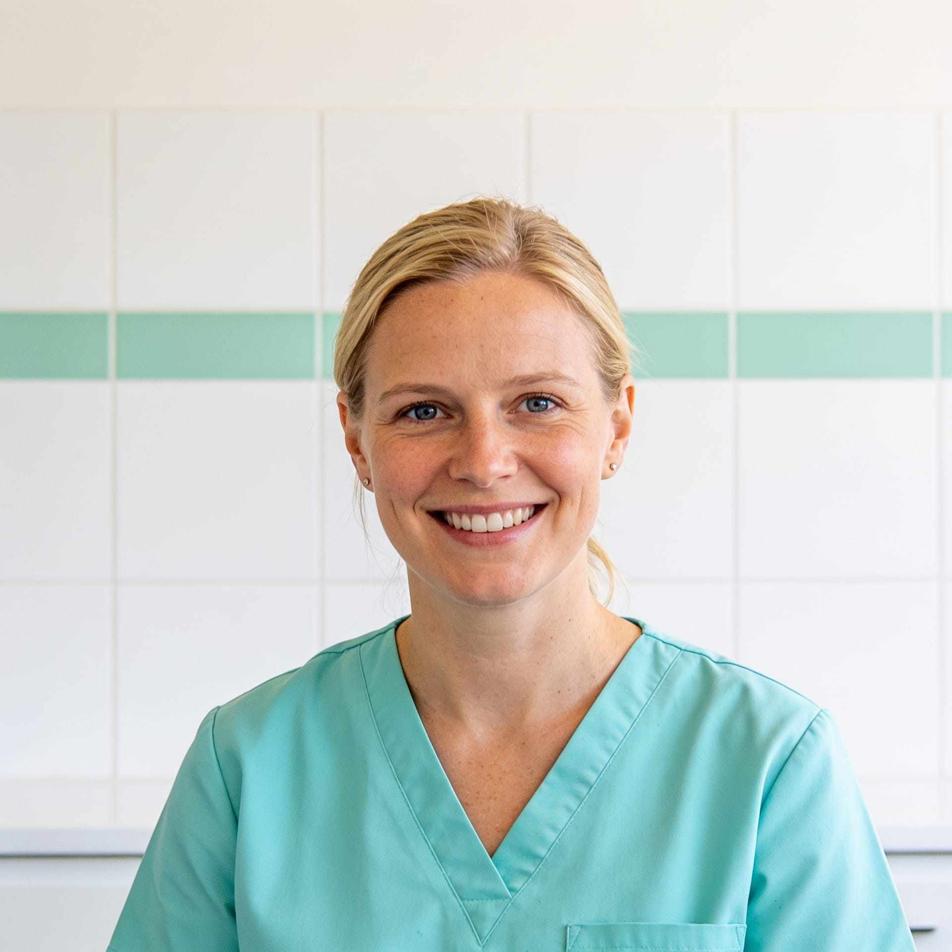 Portrait of Dr Iris Lindqvist smiling with her hair tied back